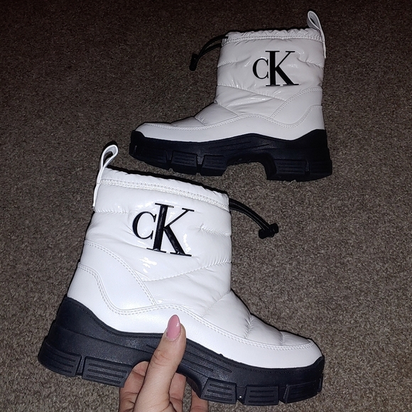 Calvin Klein Shoes - Calvin Klein white shiny puffy boots